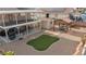 Expansive backyard features gravel ground cover, a custom pergola, an artificial lawn, and a two-story covered patio at 3008 Soledad Dr, Laughlin, NV 89029