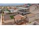 This home has a backyard with gravel, a pergola with seating, artificial turf, a shed, and a covered two-story patio at 3008 Soledad Dr, Laughlin, NV 89029