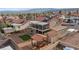 This backyard features gravel, a pergola with seating, artificial turf, a shed, and a covered two-story patio at 3008 Soledad Dr, Laughlin, NV 89029