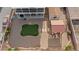 This backyard showcases gravel, a pergola with seating, artificial turf, a shed, and a covered two-story patio at 3008 Soledad Dr, Laughlin, NV 89029