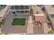 Aerial view of a low-maintenance backyard with artificial turf, patio structure, and shed at 3008 Soledad Dr, Laughlin, NV 89029