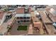 This backyard showcases gravel, a pergola with seating, artificial turf, a shed, and a covered two-story patio at 3008 Soledad Dr, Laughlin, NV 89029