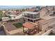 This home has a backyard with gravel, a pergola with seating, artificial turf, a shed, and a covered two-story patio at 3008 Soledad Dr, Laughlin, NV 89029