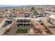 Aerial view of home features gravel, artificial turf, pergola seating, shed, and covered two-story patio at 3008 Soledad Dr, Laughlin, NV 89029