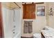 Bathroom featuring wood door accent, shower, and coordinating granite countertops at 3008 Soledad Dr, Laughlin, NV 89029