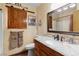 Bathroom with granite countertop, rustic wood sliding door, and ample storage at 3008 Soledad Dr, Laughlin, NV 89029