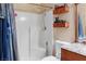 Bathroom features a walk-in shower, toilet, wood vanity with granite countertop and a decorative mirror at 3008 Soledad Dr, Laughlin, NV 89029