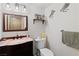 Cozy half bathroom with stylish vanity and fixtures, and decorative owl accents at 3008 Soledad Dr, Laughlin, NV 89029