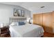 Comfortable bedroom featuring a plush bed, neutral walls, matching wooden furniture, and hardwood floors at 3008 Soledad Dr, Laughlin, NV 89029