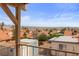 Scenic view from a balcony overlooking rooftops, a mix of trees, and a vast mountain landscape at 3008 Soledad Dr, Laughlin, NV 89029