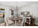 Bright dining room with wooden table, white wainscoting and access to backyard at 3008 Soledad Dr, Laughlin, NV 89029