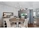Charming dining room with a rustic table, elegant chandelier, and stylish decor at 3008 Soledad Dr, Laughlin, NV 89029