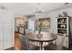 Cozy dining area featuring a wooden table with backyard access and farmhouse decor at 3008 Soledad Dr, Laughlin, NV 89029