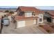 Attractive two-story home with a tile roof, desert landscaping, and an attached garage at 3008 Soledad Dr, Laughlin, NV 89029