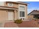 Close-up of a charming home's facade, showcasing the tiled roof and well-maintained yard at 3008 Soledad Dr, Laughlin, NV 89029