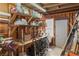 Interior garage area with tools, equipment, and supplies stored along the wall and on shelves at 3008 Soledad Dr, Laughlin, NV 89029