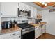 Kitchen with stainless appliances, gas range, butcher block countertop and white cabinetry at 3008 Soledad Dr, Laughlin, NV 89029
