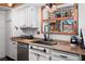 Kitchen featuring a stainless steel sink, wooden window trim, and decor at 3008 Soledad Dr, Laughlin, NV 89029