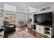 Bright and airy living room with hardwood floors, lots of natural light, and neutral decor at 3008 Soledad Dr, Laughlin, NV 89029