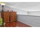 A loft space is accented by hardwood floors, white walls, a wooden railing and a small window at 3008 Soledad Dr, Laughlin, NV 89029