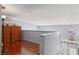 A loft space is accented by hardwood floors, white walls, a wooden railing and a small window at 3008 Soledad Dr, Laughlin, NV 89029