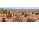 Panoramic rooftop view showcasing red tile roofs and the city skyline against a mountain backdrop at 3008 Soledad Dr, Laughlin, NV 89029