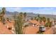 Rooftop perspective of distant city and mountain views, with palm trees visible between homes at 3008 Soledad Dr, Laughlin, NV 89029