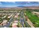 This gorgeous aerial view showcases a golf course community with desert mountains in the background at 301 Lakewood Garden Dr, Las Vegas, NV 89148