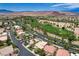 This aerial view highlights the property's prime location near a golf course and scenic landscapes at 301 Lakewood Garden Dr, Las Vegas, NV 89148