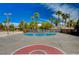 Outdoor basketball court with shade trees, landscaping, and volleyball court nearby at 301 Lakewood Garden Dr, Las Vegas, NV 89148