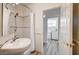 Bathroom view showing a sink with a curtained shower and a glimpse into the laundry room at 301 Lakewood Garden Dr, Las Vegas, NV 89148