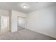 A bedroom with neutral carpet and a closet with mirrored doors at 301 Lakewood Garden Dr, Las Vegas, NV 89148