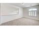 Bedroom featuring carpeted floor and a window with stylish shutters at 301 Lakewood Garden Dr, Las Vegas, NV 89148