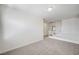 Bonus room space with carpeted floors, a stairway and bright white walls at 301 Lakewood Garden Dr, Las Vegas, NV 89148