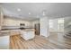 Open kitchen layout with large island, stainless steel appliances, and views into the living room at 301 Lakewood Garden Dr, Las Vegas, NV 89148