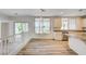 Bright kitchen boasts stainless steel appliances, granite countertops, and a large window with neighborhood views at 301 Lakewood Garden Dr, Las Vegas, NV 89148