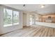 Open living area features wood-look floors, recessed lighting, and views of the backyard at 301 Lakewood Garden Dr, Las Vegas, NV 89148