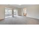 Main bedroom with sliding glass doors to balcony and a doorway to the ensuite bathroom at 301 Lakewood Garden Dr, Las Vegas, NV 89148