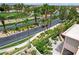 Street view of this property near a well-manicured golf course with beautiful landscaping at 301 Lakewood Garden Dr, Las Vegas, NV 89148