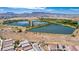 Aerial view of houses near scenic lakes and winding walking paths at 330 Spring Dove Ave, Henderson, NV 89011