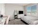 Bright bedroom with a soft color palette, plush carpet, and a large window at 330 Spring Dove Ave, Henderson, NV 89011