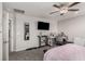 Spacious bedroom featuring a ceiling fan, desk, and adjacent bathroom at 330 Spring Dove Ave, Henderson, NV 89011