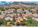Scenic aerial view features houses with solar panels, lush gardens, and an outdoor seating area at 3412 Crystal Tower St, Las Vegas, NV 89129