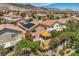 Aerial view shows well-maintained homes, mature trees, and landscaping under the bright desert sky at 3412 Crystal Tower St, Las Vegas, NV 89129