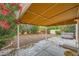 Back patio features a covered area, mature landscaping, and a hot tub at 3412 Crystal Tower St, Las Vegas, NV 89129