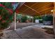 Backyard patio with a covered area, hot tub, and lush tropical landscaping at 3412 Crystal Tower St, Las Vegas, NV 89129
