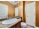 Half bathroom features granite countertops, modern faucet, ample lighting and a mirror at 3412 Crystal Tower St, Las Vegas, NV 89129