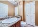 Bathroom with granite countertop, under-mount sink, bronze fixtures and white painted door at 3412 Crystal Tower St, Las Vegas, NV 89129