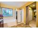 Bathroom showcasing a soaking tub and glass-enclosed shower at 3412 Crystal Tower St, Las Vegas, NV 89129