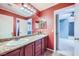 Bright bathroom with double sinks, granite countertops, and decorative lighting at 3412 Crystal Tower St, Las Vegas, NV 89129
